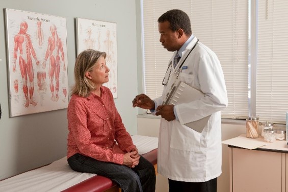 Doctor speaking with patient